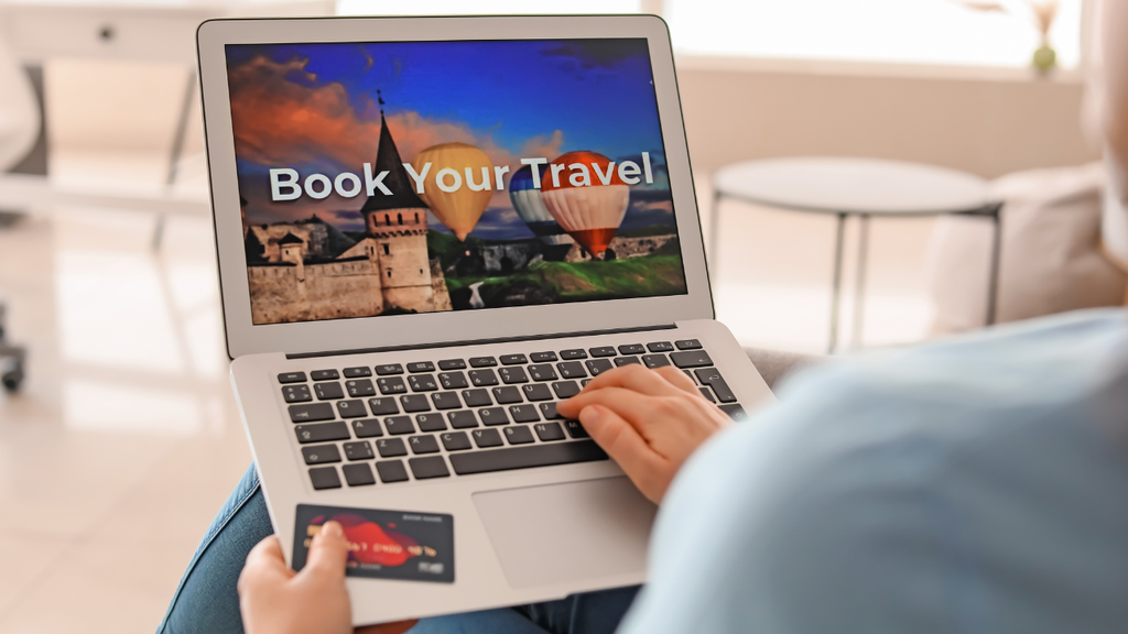 Traveler making trip reservations on a laptop