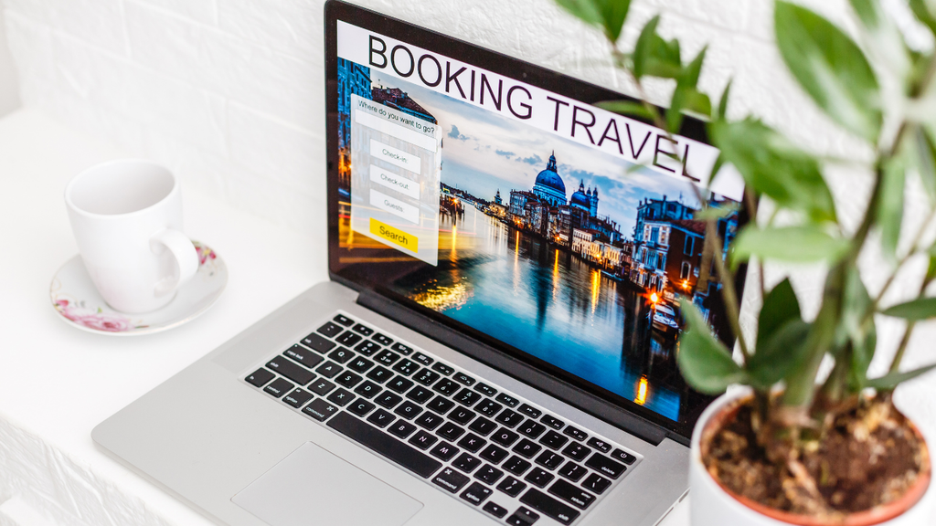 Laptop displaying an online travel booking website
